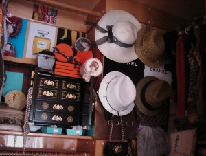 Hooks help to arrange some hats, scarves & a few bags.  